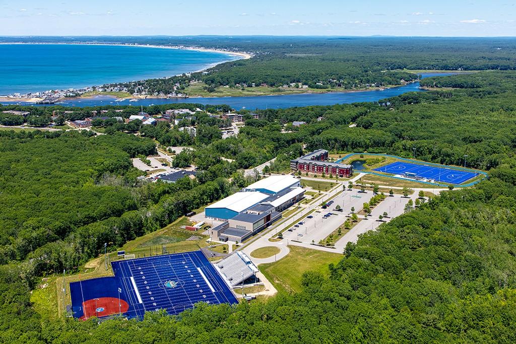 An aerial photo of the Biddeford Campus including the Saco River and Atlantic Ocean